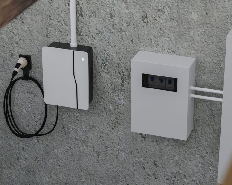 Residential EV Charger and Electrical Control Box Installation Wall-mounted electric vehicle charging station with black cable and white connector next to white electrical control panel with circuit breakers visible through window, installed on gray concrete wall